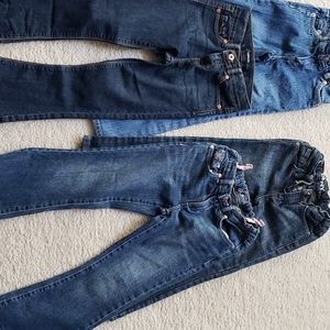 Four pairs of size 5t jeans for girls